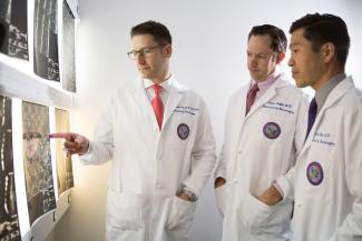 (From left) UF Health neurosurgeons William Fox, M.D., Adam Polifka, M.D. and Daniel Hoh, M.D., are part of a multidisciplinary team improving care for patients with back and neck pain at the UF Health Comprehensive Spine Center.